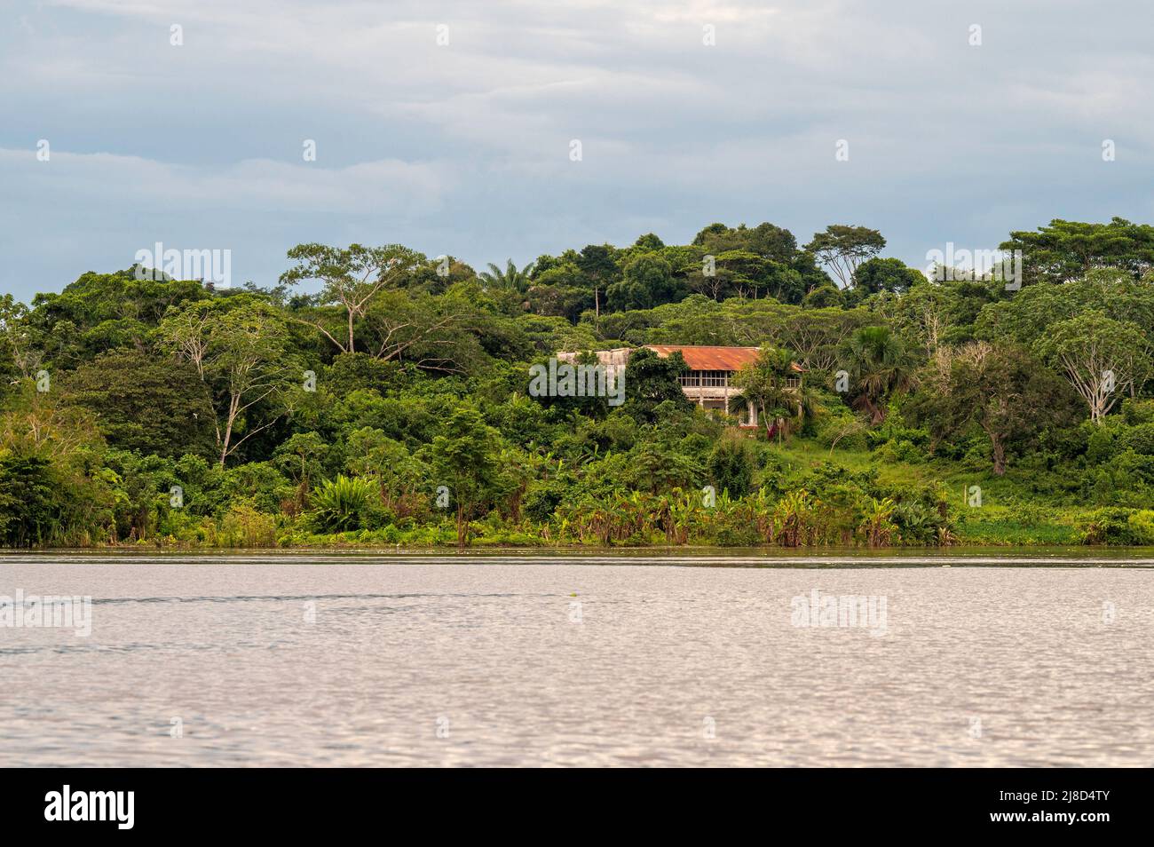 Old mansion from the Rubber Boom era on the Amazon River in Peru Stock Photo