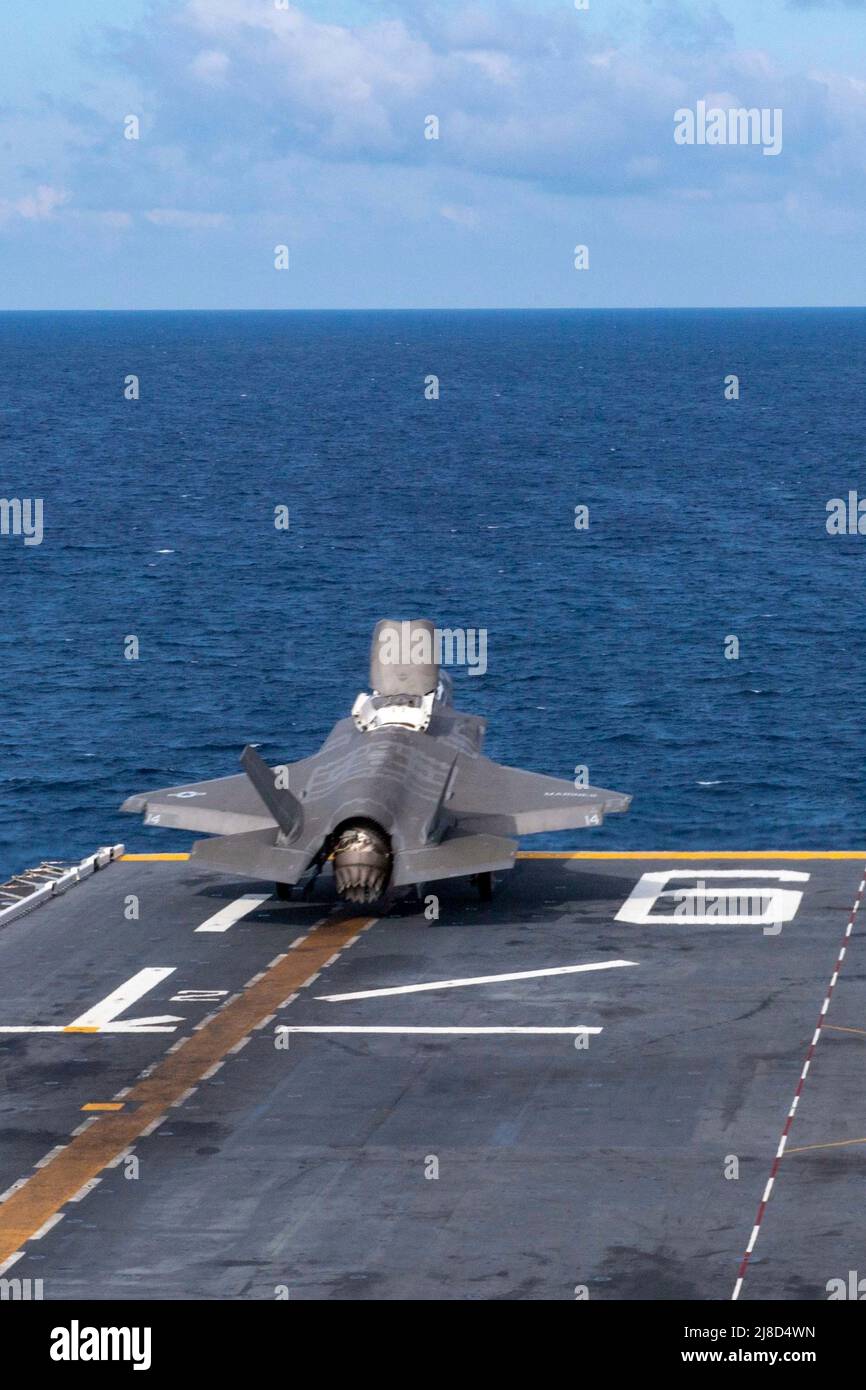 A U.S. Marine Corps F-35B Lightning II fighter aircraft, attached to the Dragons of Marine Medium Tiltrotor Squadron 265, launches from the flight deck of the America-class amphibious assault ship USS America, April 20, 2020 operating on the South China Sea. Stock Photo