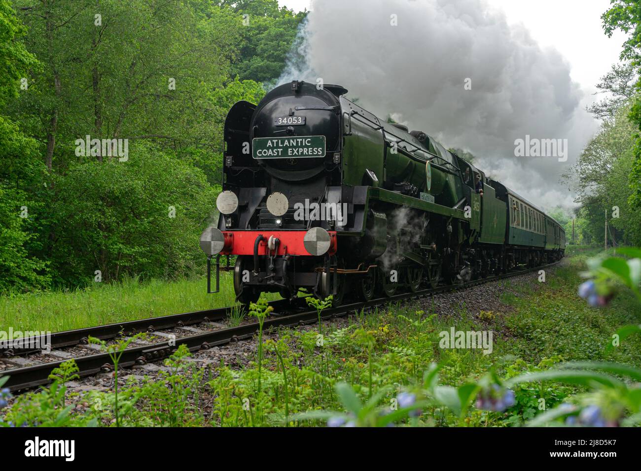 Royal Tunbridge Wells, Kent, UK. 15th May, 2022. Battle of Britain number 34053, 'Sir Keith Park' Pacific Class locomotive makes its final pleasure trips along the historic Spa Valley Railway on a wet sunday afternoon in May before being withdrawn for boiler overhaul. Credit: Sarah Mott/Alamy Live News Stock Photo