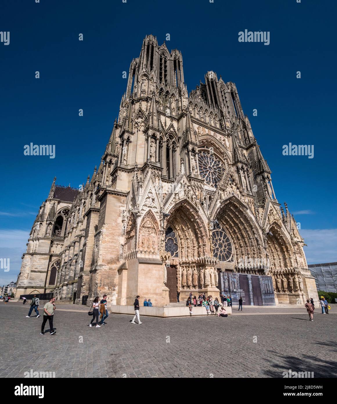 The image is of the famous 13th century Cathedral Notre Dame des Reims famed for its association with Joan of Arc, that overlooks the city square. Stock Photo