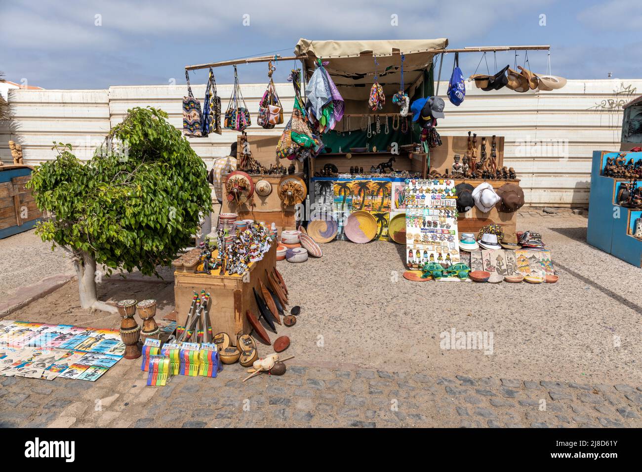 A colourful stall of a street vendor selling souvenirs to tourists