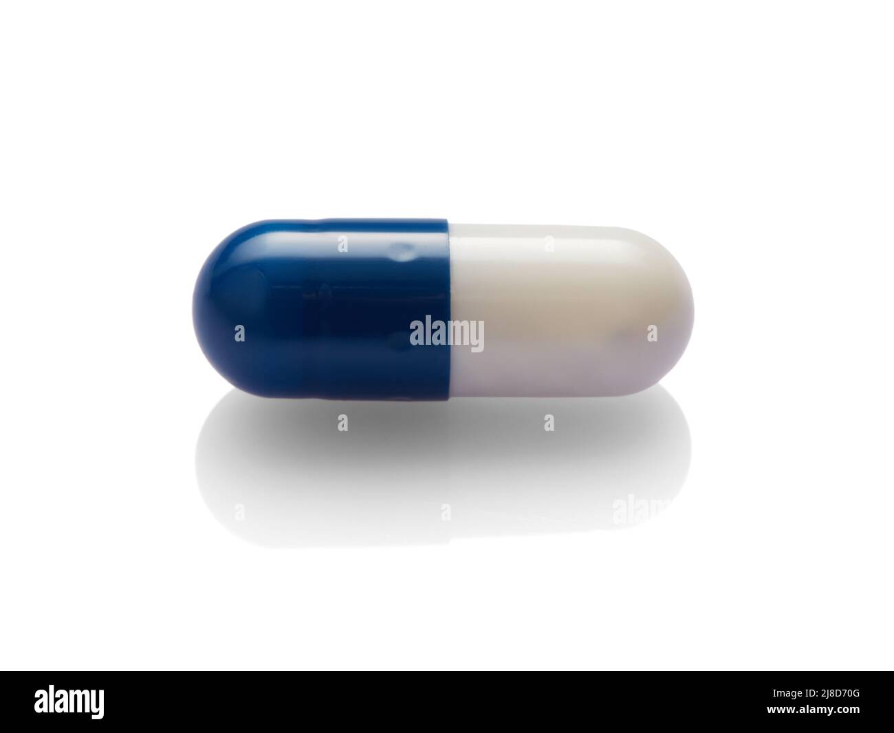 Blue capsule isolated on white background. Stock Photo
