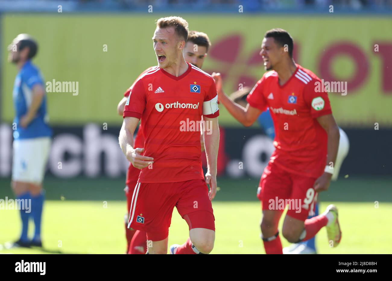 Rostock, Germany. 15th May, 2022. Soccer: 2nd Bundesliga, Hansa Rostock - Hamburger SV, Matchday 34, Ostseestadion. Sebastian Schonlau (front) of Hamburger SV celebrates his goal to make it 1:2. Credit: Danny Gohlke/dpa - IMPORTANT NOTE: In accordance with the requirements of the DFL Deutsche Fußball Liga and the DFB Deutscher Fußball-Bund, it is prohibited to use or have used photographs taken in the stadium and/or of the match in the form of sequence pictures and/or video-like photo series./dpa/Alamy Live News Stock Photo