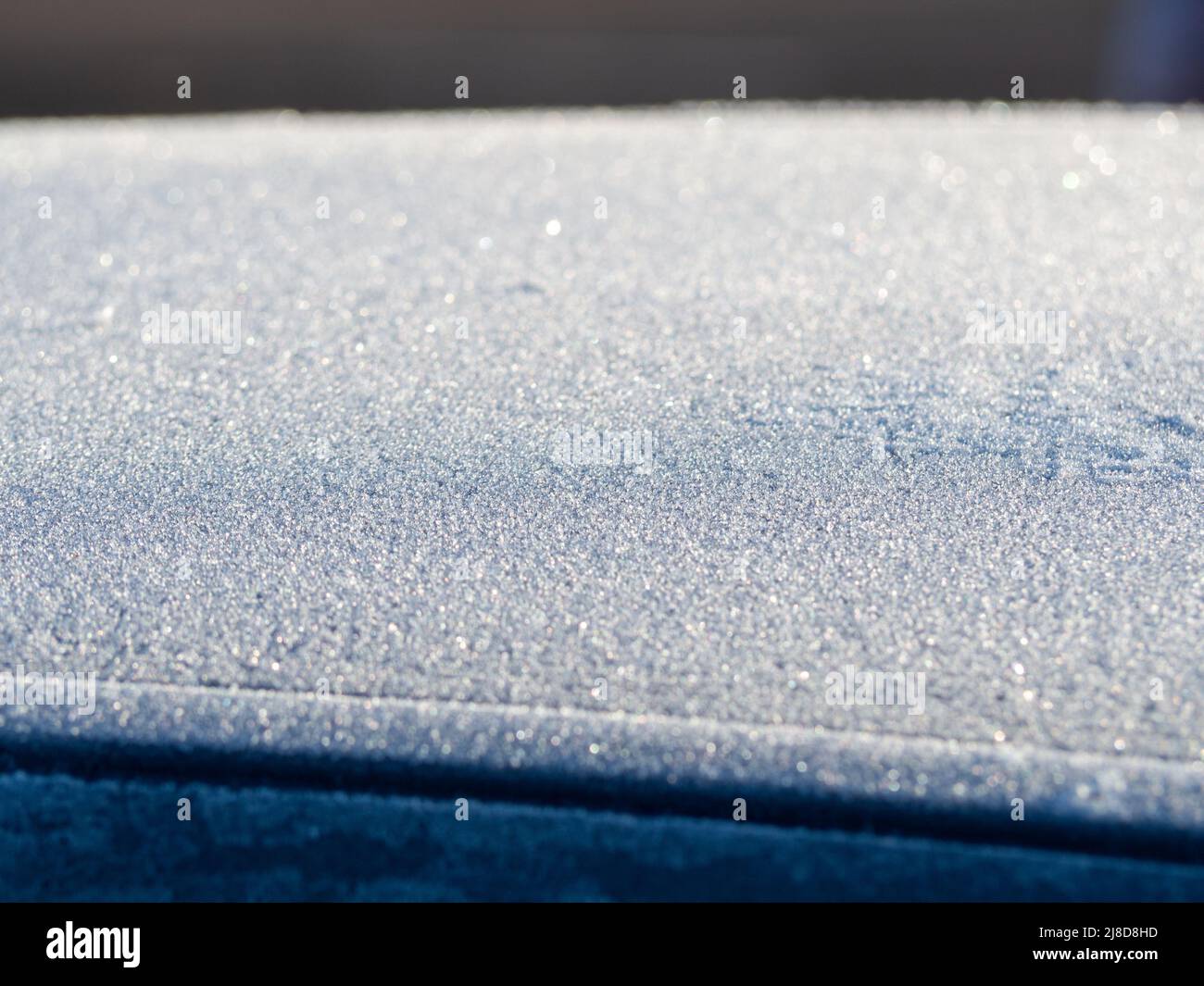 Frozen car on the street on a winter day. Stock Photo