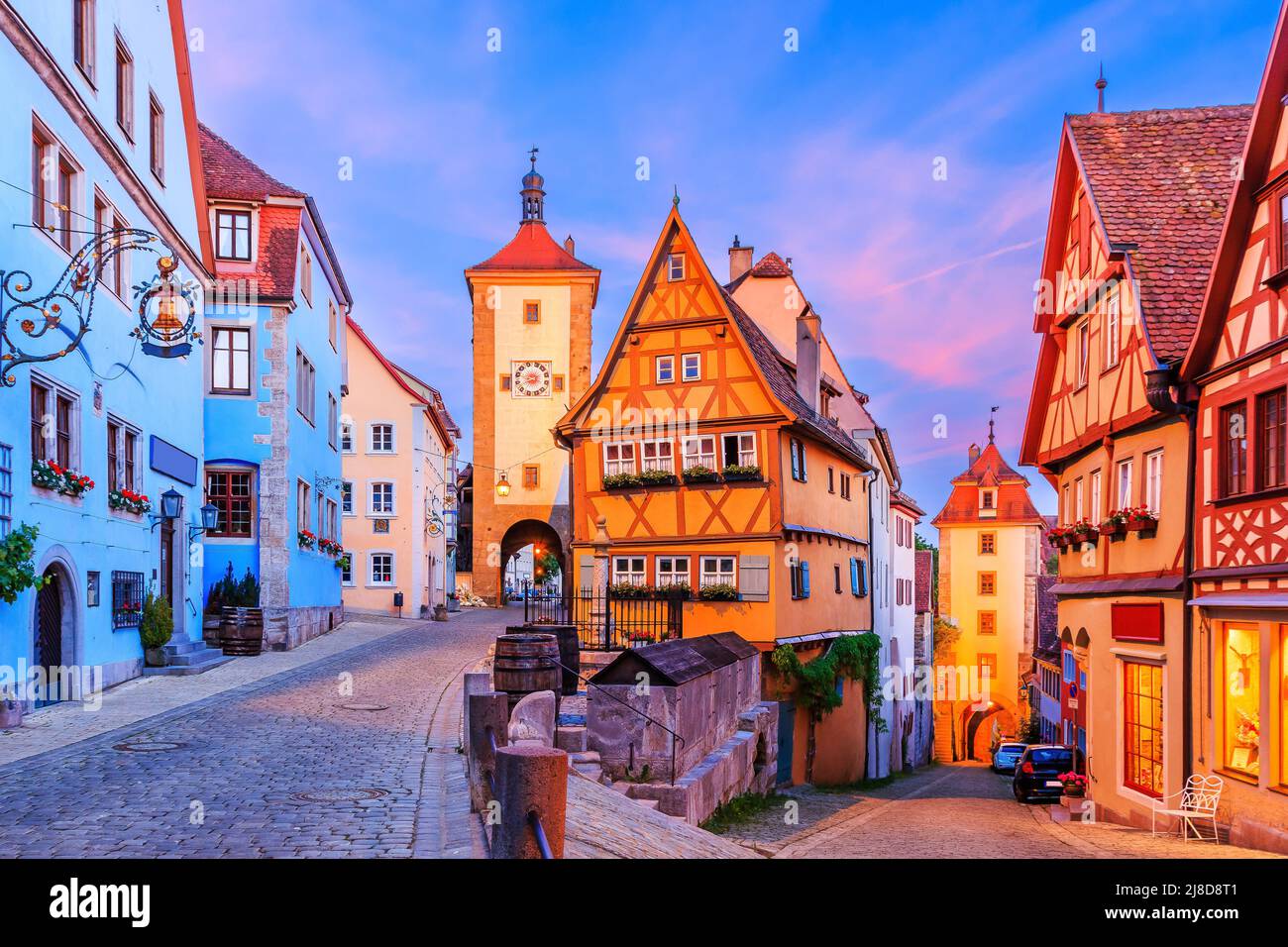 Rothenburg ob der Tauber, Bavaria, Germany. Medieval town of Rothenburg at night. Plonlein(Little Square) and the two towers of the old city wall. Stock Photo