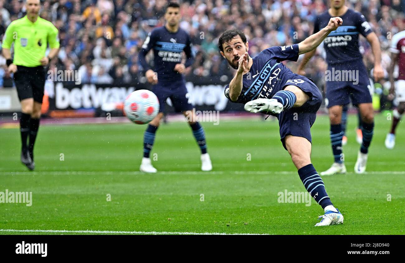 London UK 15th May 2022. Bernardo Silva (Manchester City) has a shot during  the West Ham vs Manchester City Premier League match at the London Stadium  Stratford.Credit: Martin Dalton/Alamy Live News. This