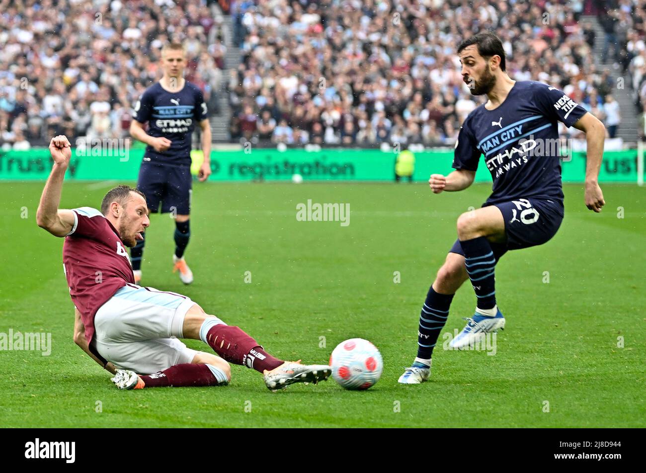 London UK 15th May 2022. Vladimír Coufal (West Ham) slides in to clear