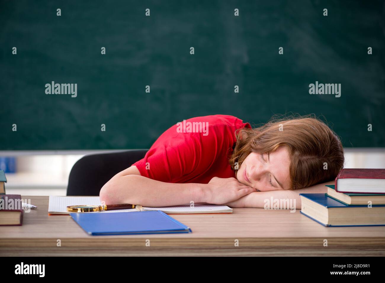 Female student preparing for exams in the classroom Stock Photo - Alamy