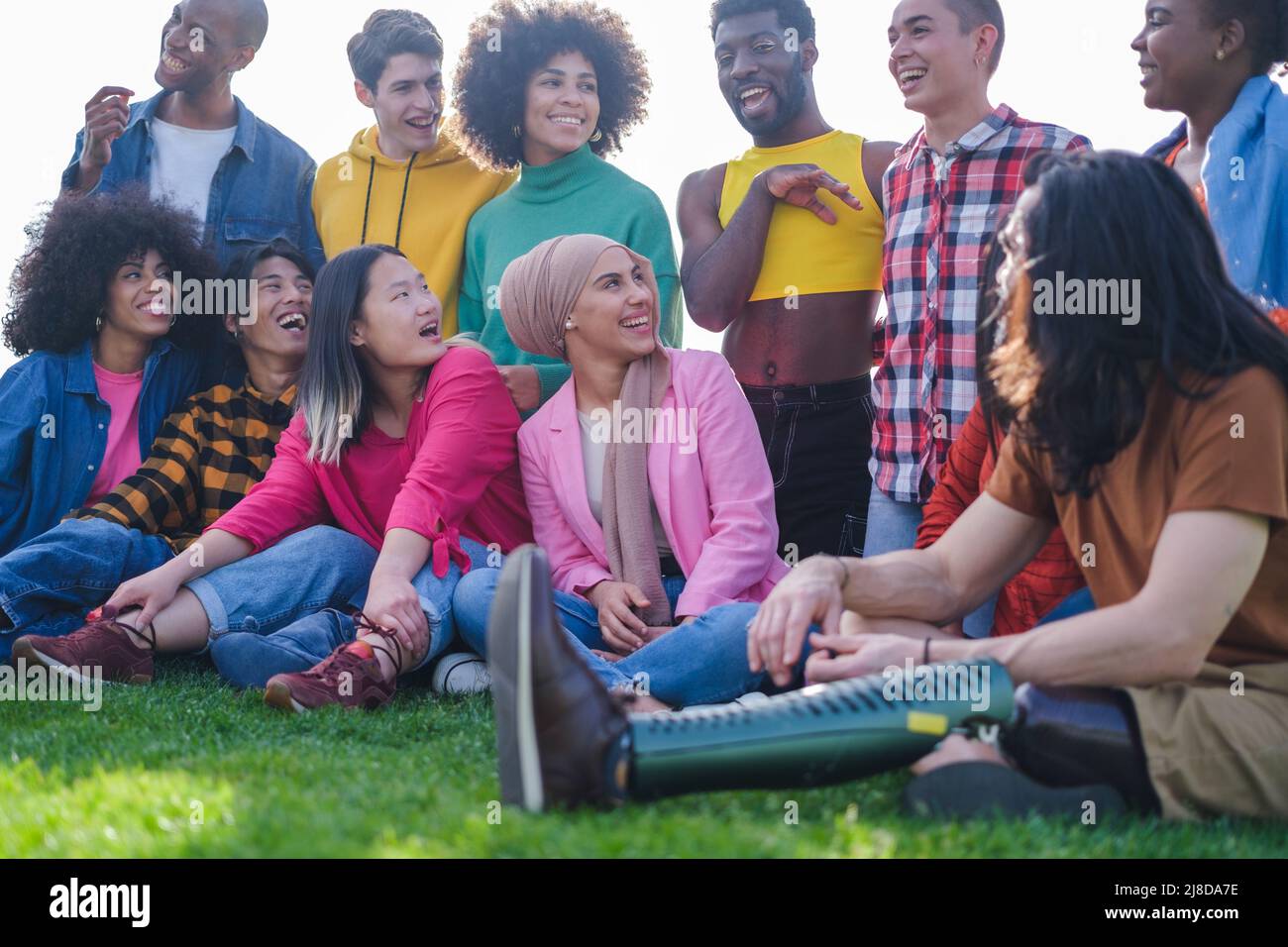 Multi-ethnic group young people having a good time together Stock Photo ...