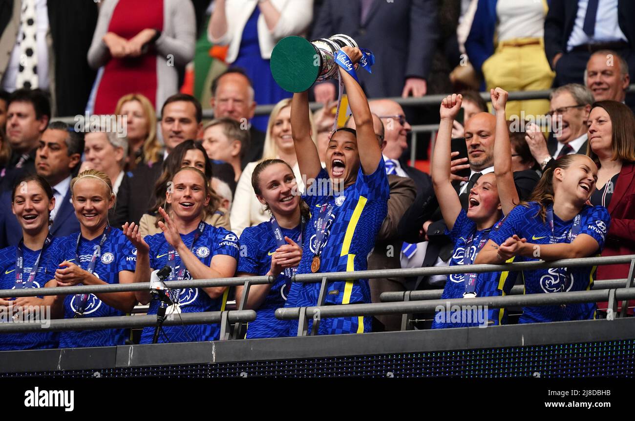 Chelsea's Sam Kerr lifts the trophy and celebrate with teammates after