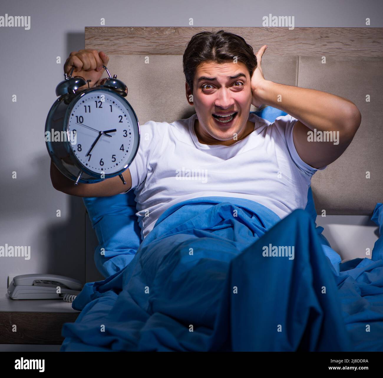 The man having trouble sleeping in bed stock photo alamy