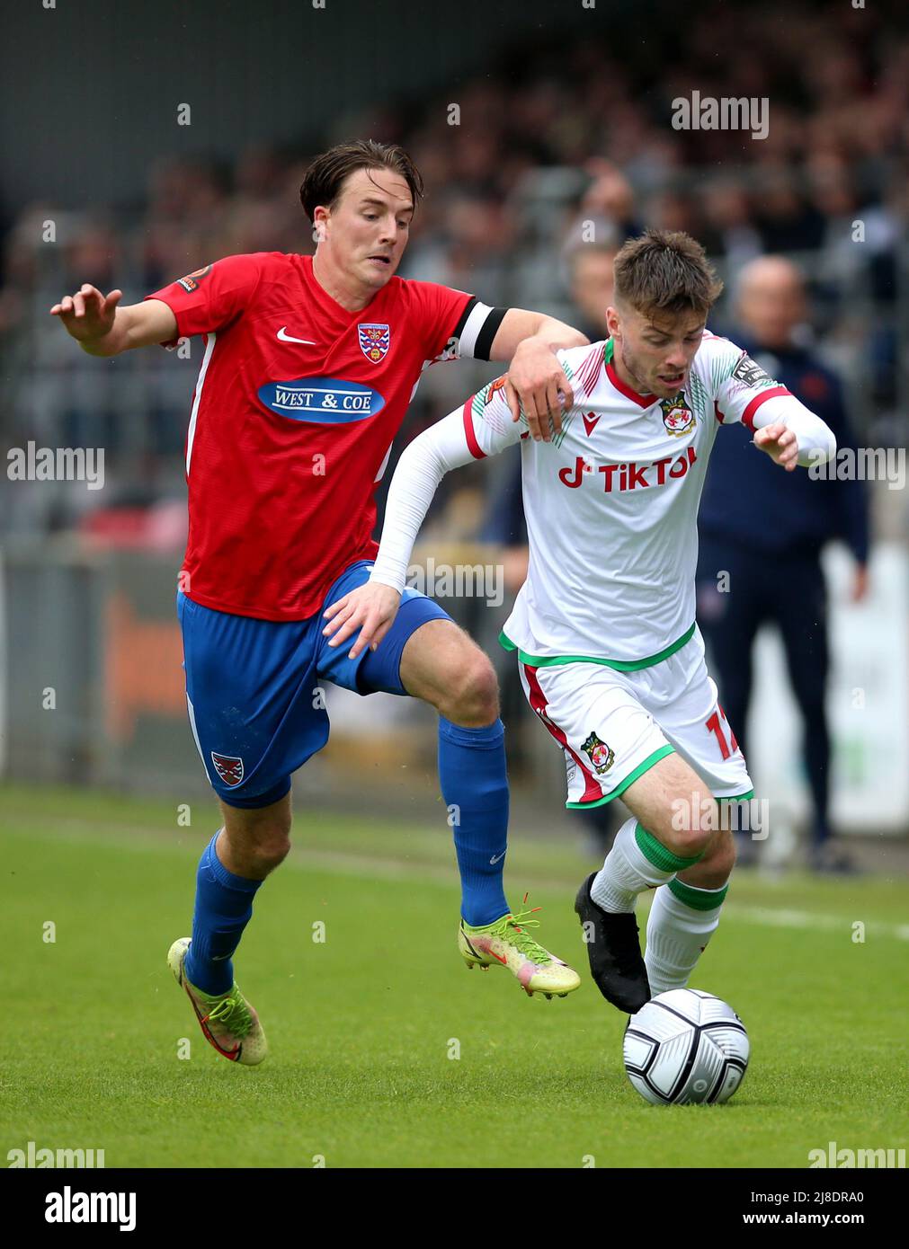 Dagenham and Redbridge's Will Wright (left) and Wrexham's Daniel Jarvis