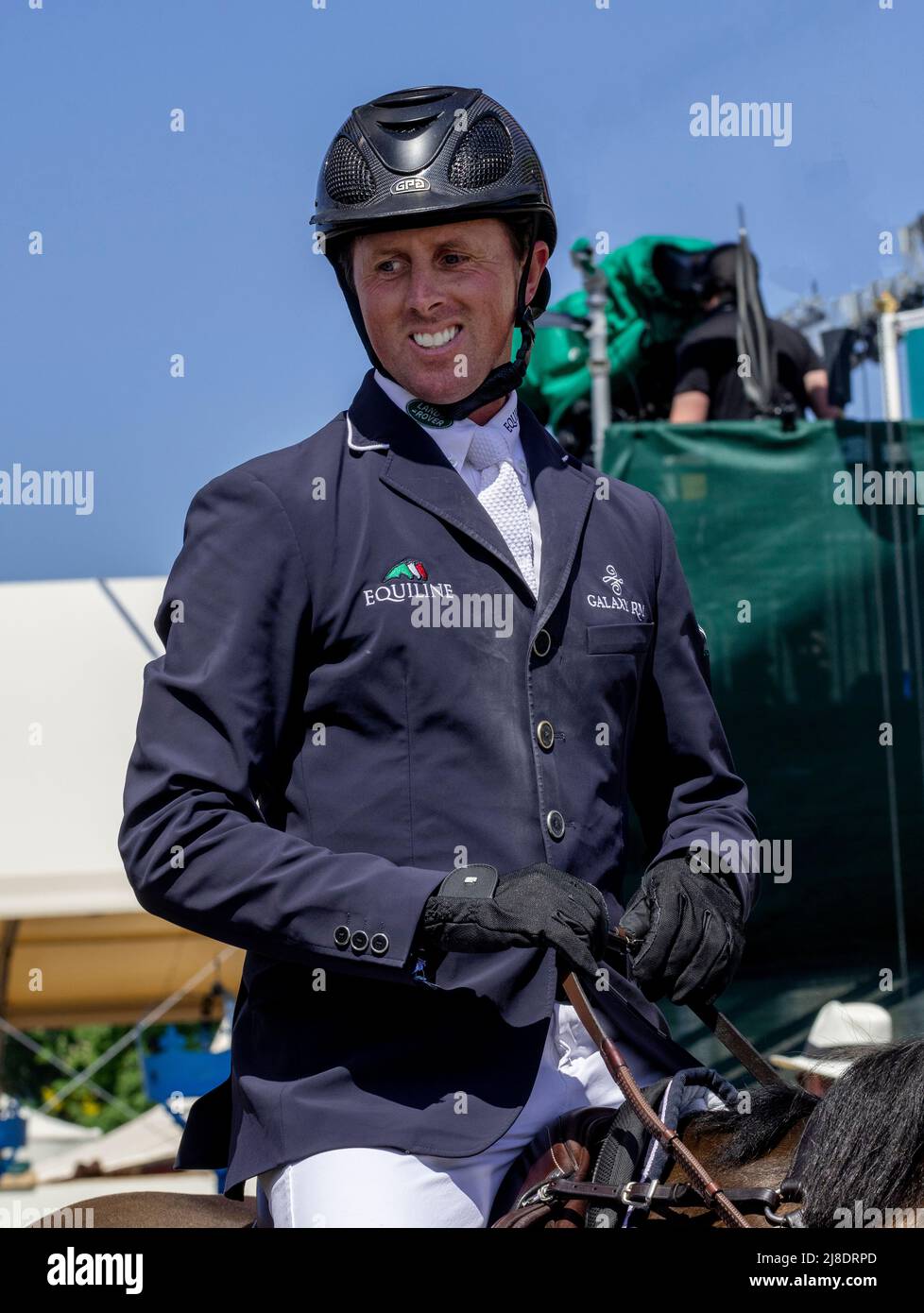 Windsor Berkshire UK 14 May 2022 Ben Maher, British Olympian  show jumper, in the warm-up ring before the Rolex Grand Prix CS15 jumping in the Carle Area at the Royal Windsor Horse Show   Credit. Gary Blake/ Alamy Live News Stock Photo