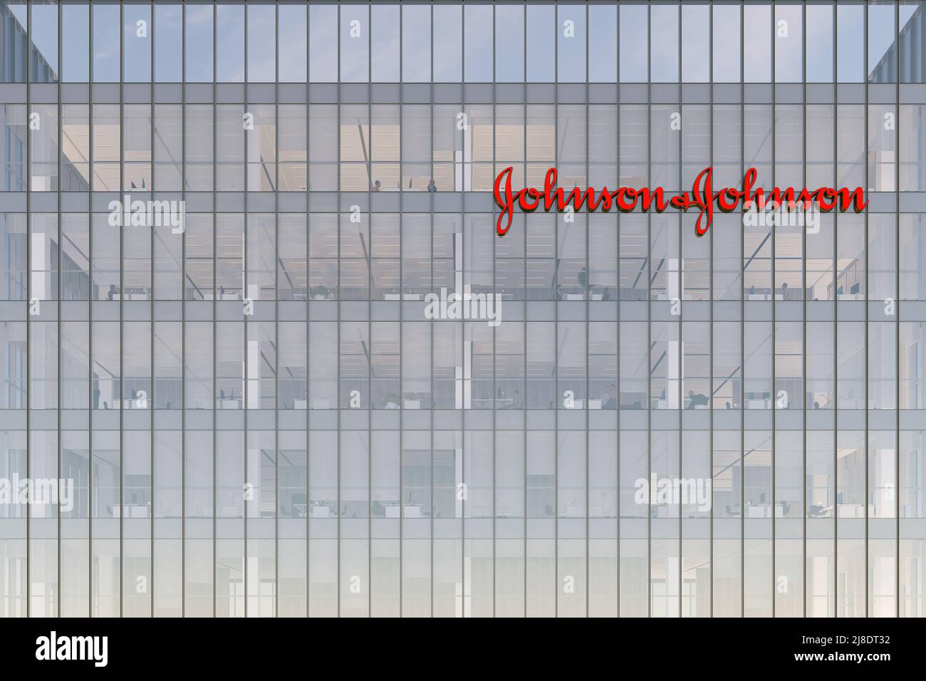 New Brunswick, NJ, USA. May 2, 2022. Editorial Use Only, 3D CGI. Johnson & Johnson Signage Logo on Top of Glass Building. Workplace of Pharmaceutical Stock Photo
