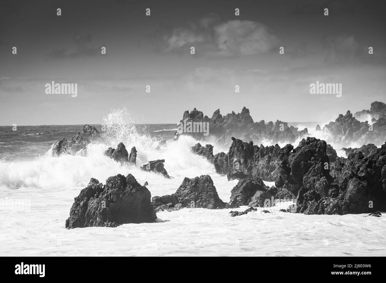 Powerful waves against the sea stacks of Lanzarote island, Atlantic Ocean, Canary Islands, Spain Stock Photo