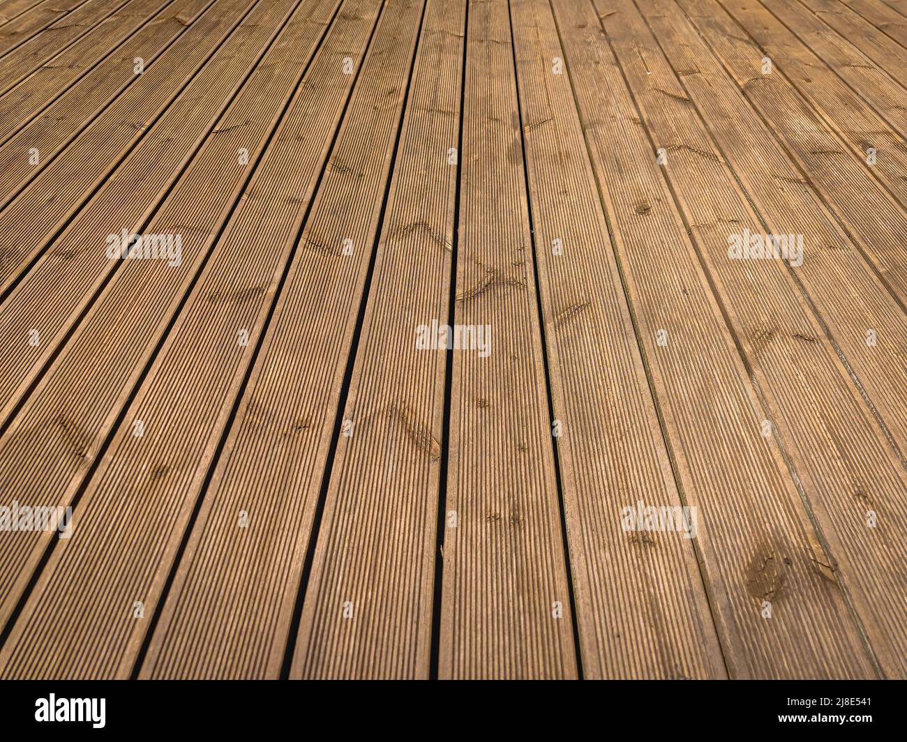 Wooden terrace with brown boards on the terrace floor. Decking without nails Stock Photo