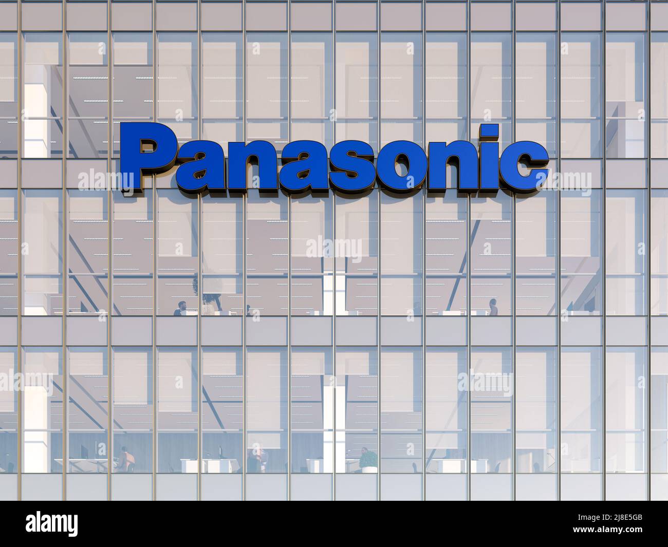 Kadoma, Osaka, Japan. May 2, 2022. Editorial Use Only, 3D CGI. Panasonic Signage Logo on Top of Glass Building. Workplace Multinational Industrial Con Stock Photo