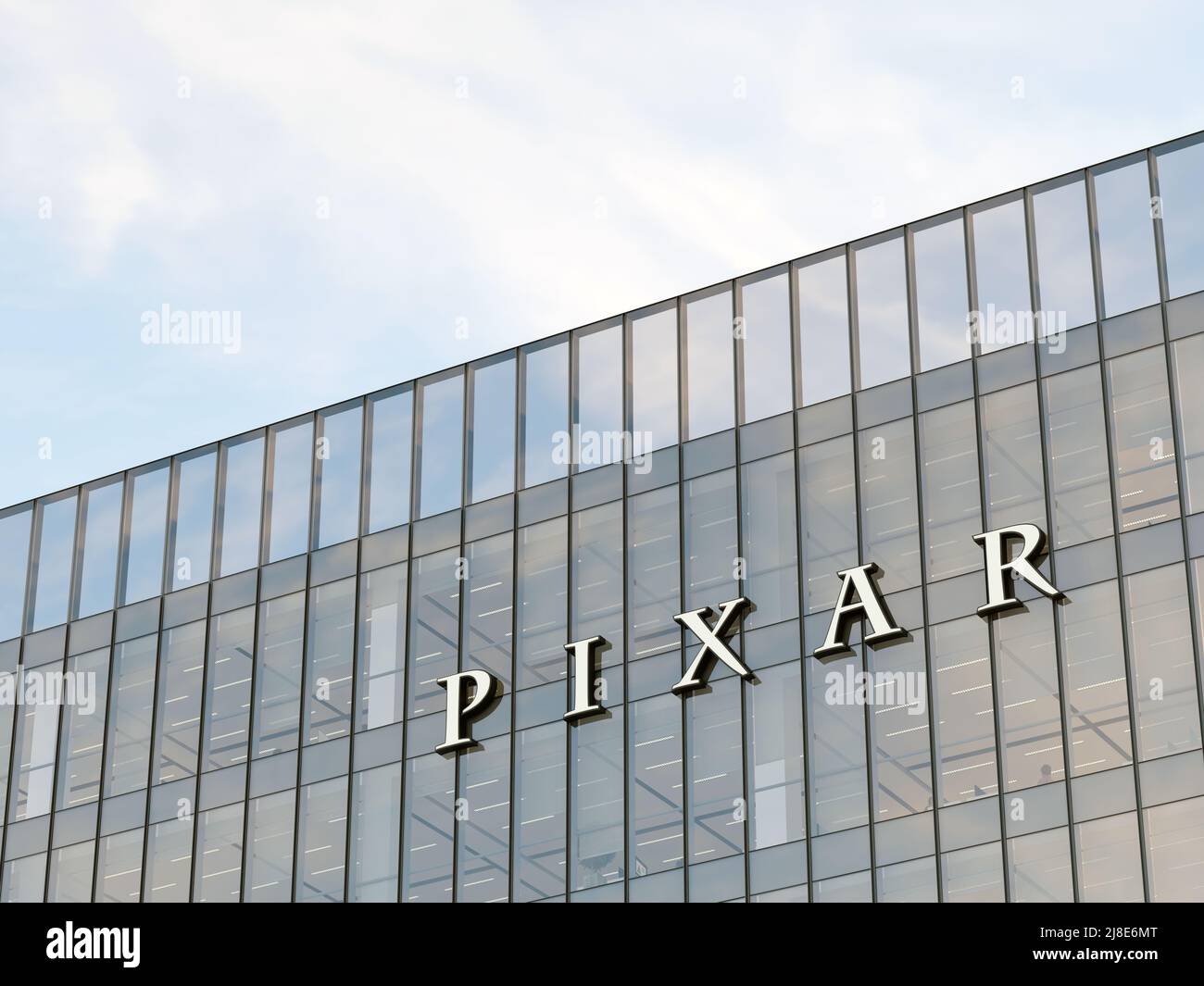 Emeryville, CA, USA. May 2, 2022. Editorial Use Only, 3D CGI. Pixar Signage Logo on Top of Glass Building. Workplace Commercial Animation Studio Compa Stock Photo