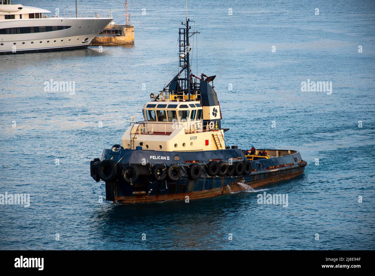 Bridgetown, Barbados - 26 March 2022:  The tug boat Pelican II working in Bridgetown Harbour Stock Photo