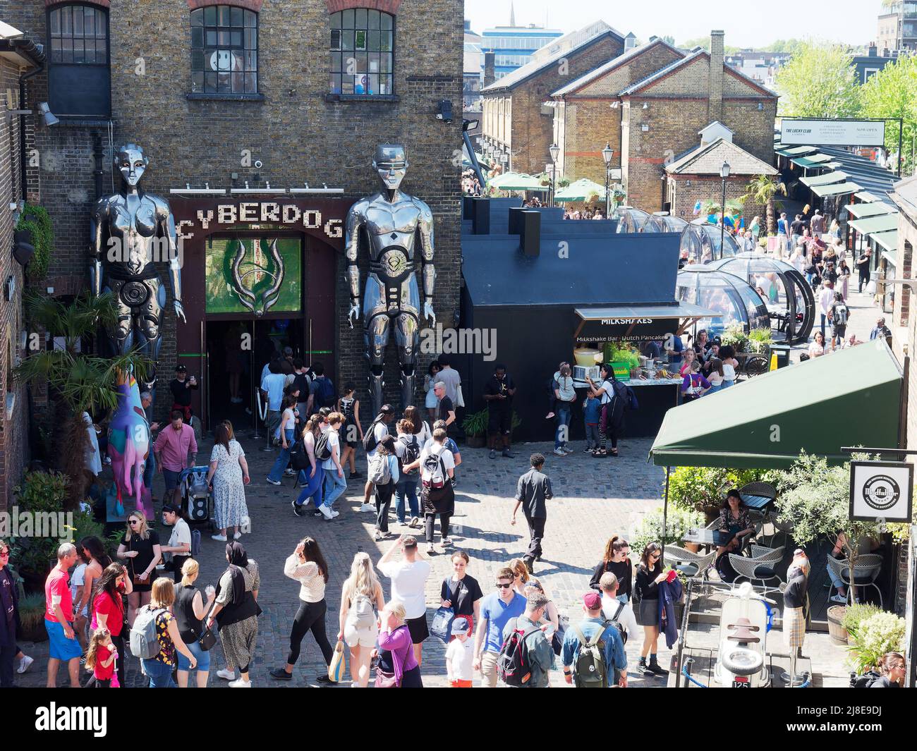 View looking down on tourists and shoppers walking around busy Camden Market in London Stock Photo