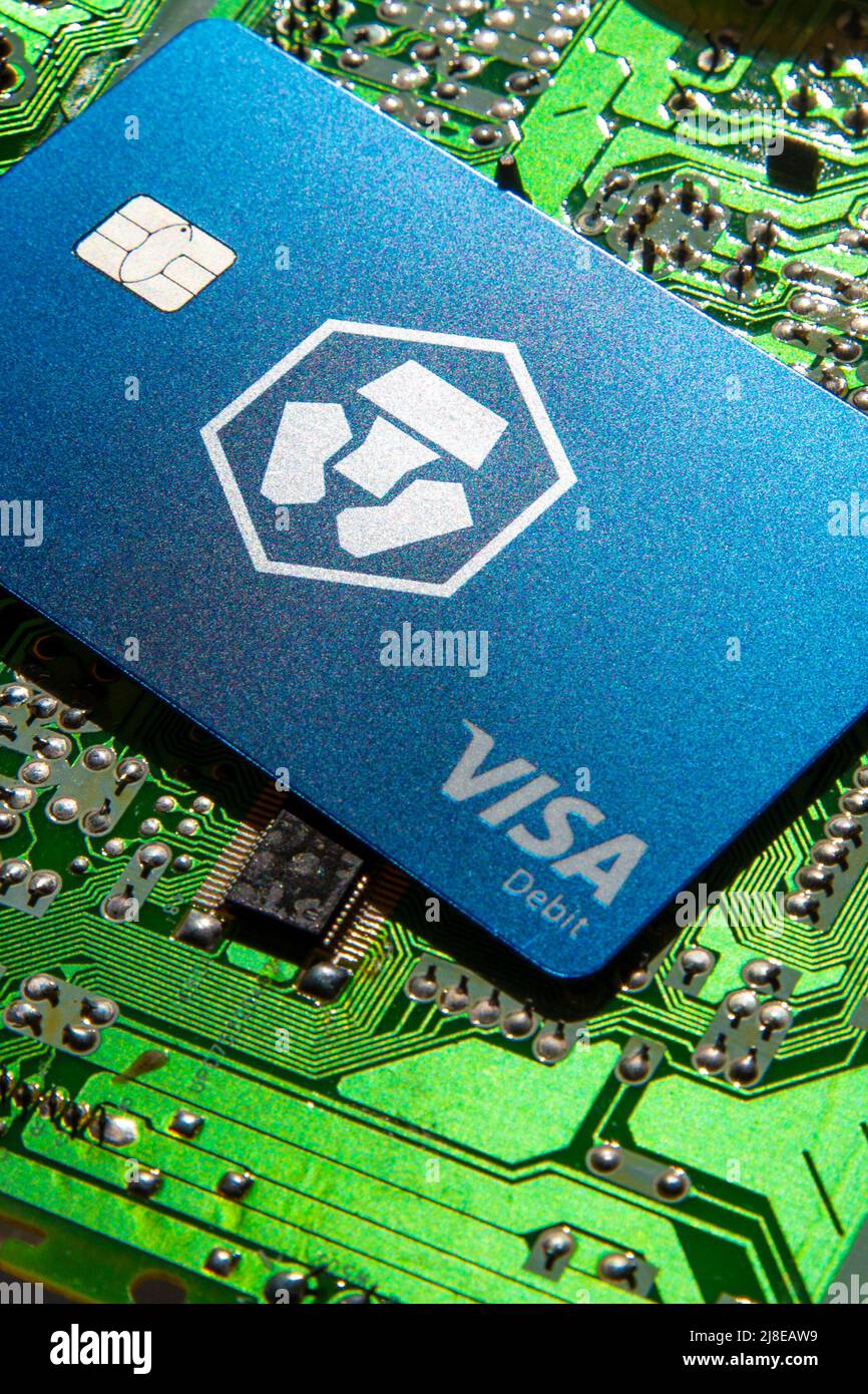 Crypto.com Visa Debit Reward Card on circuit board background Stock Photo