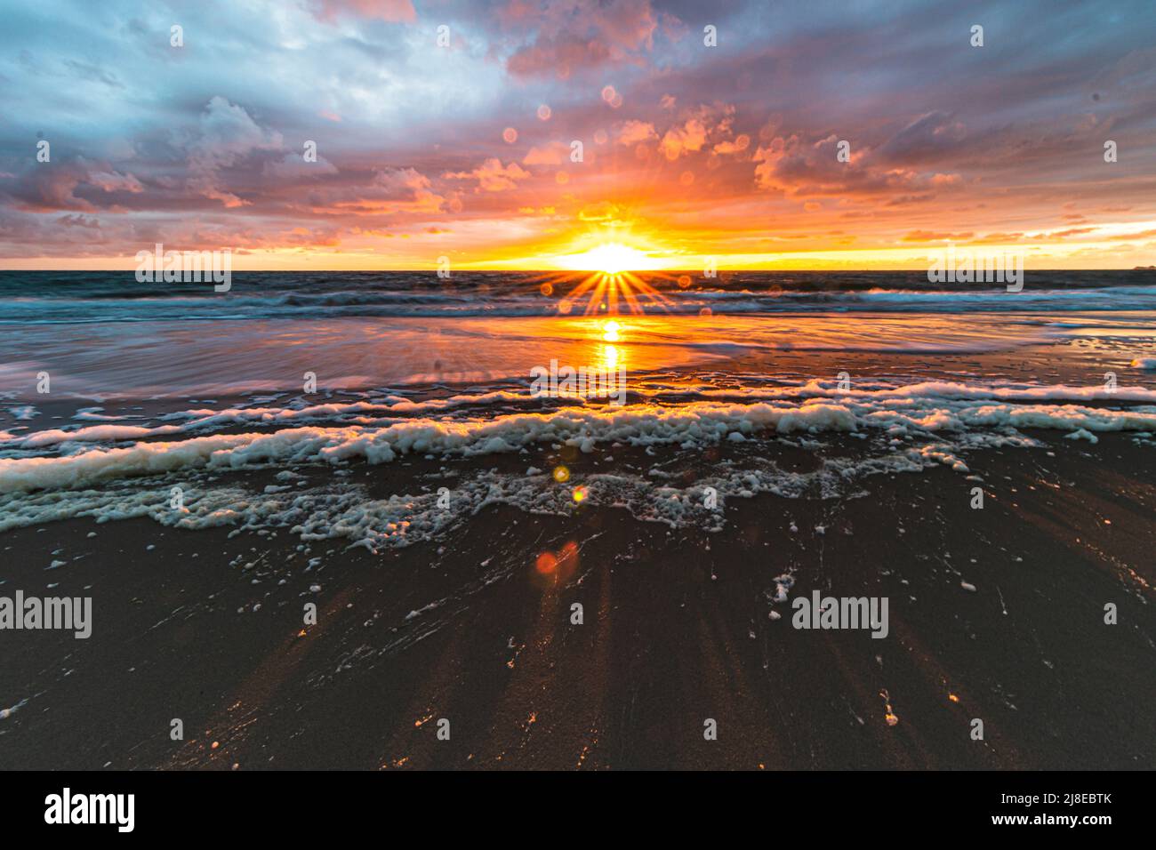 sunset in zeeland dutch north sea Stock Photo Alamy