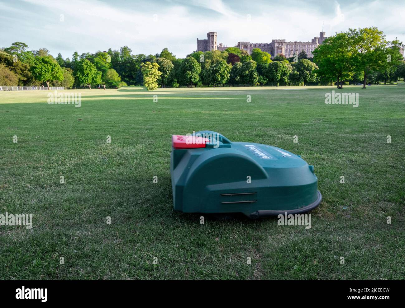 Windsor Berkshire UK 14 May 2022 Remote lawn mower  deemed with the task of cutting the grass on the lawn at the   Home Park, a 655-acre Royal park , and which the Royal Windsor Horse Show occupies part of it for the duration of the show Credit. Gary Blake/ Alamy Live News Stock Photo