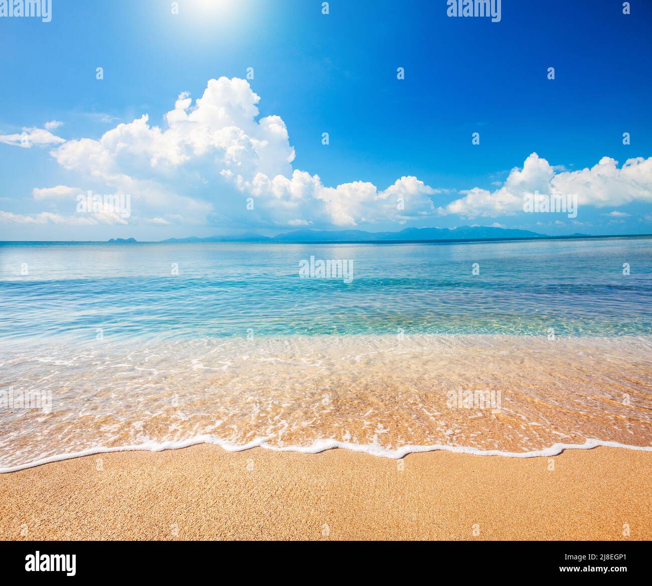 Sandy beach and beautiful tropical sea Stock Photo
