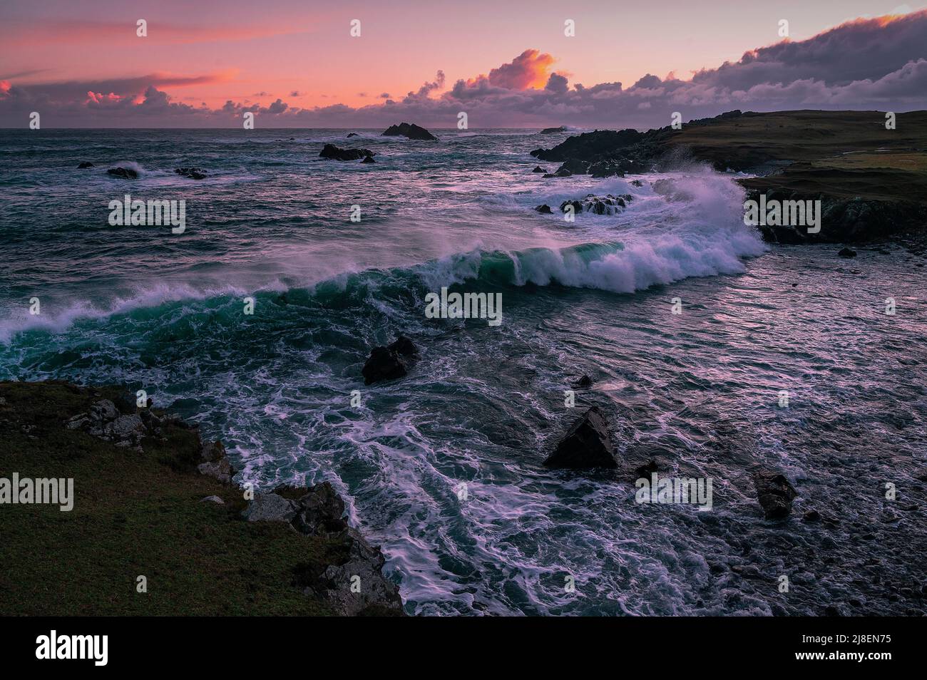 Wild seas around the rocky shores of the south coast of Fair Isle Stock Photo