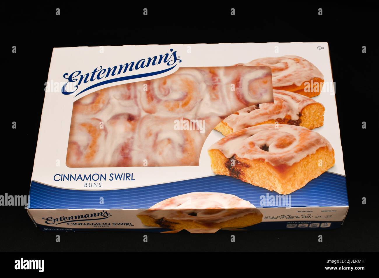 A package of six Entenmann's cinnamon swirl buns, ready to eat or warmed in the microwave, isolated on black Stock Photo