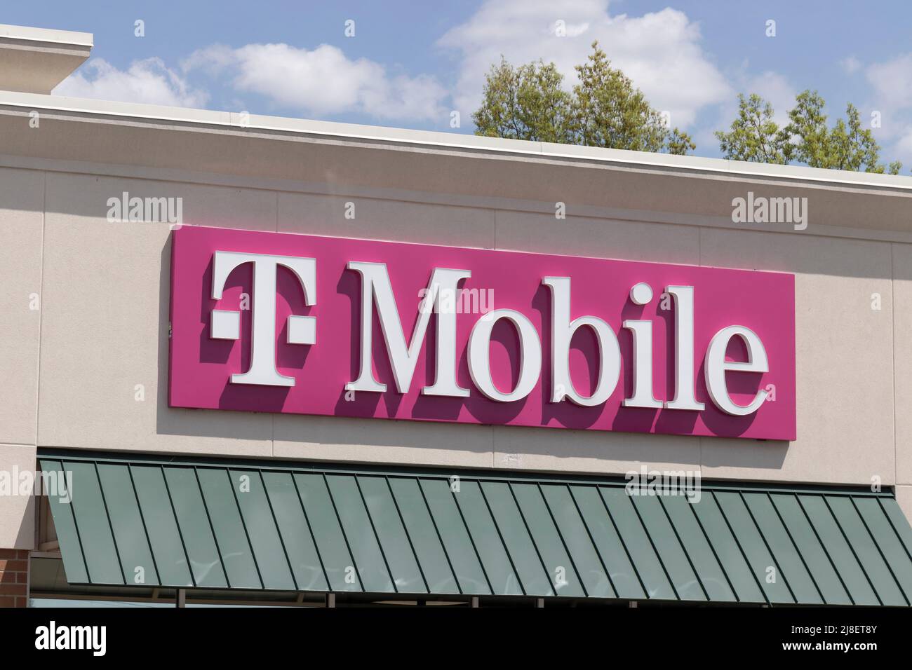 Elkhart - Circa May 2022: T-Mobile cell and mobile phone store. T-Mobile merged with Sprint to create a larger 5G internet and communications network. Stock Photo