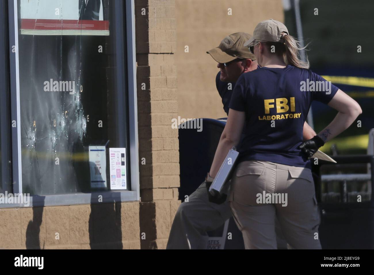 Buffalo, United States. 15th May, 2022. Members of the FBI evidence ...