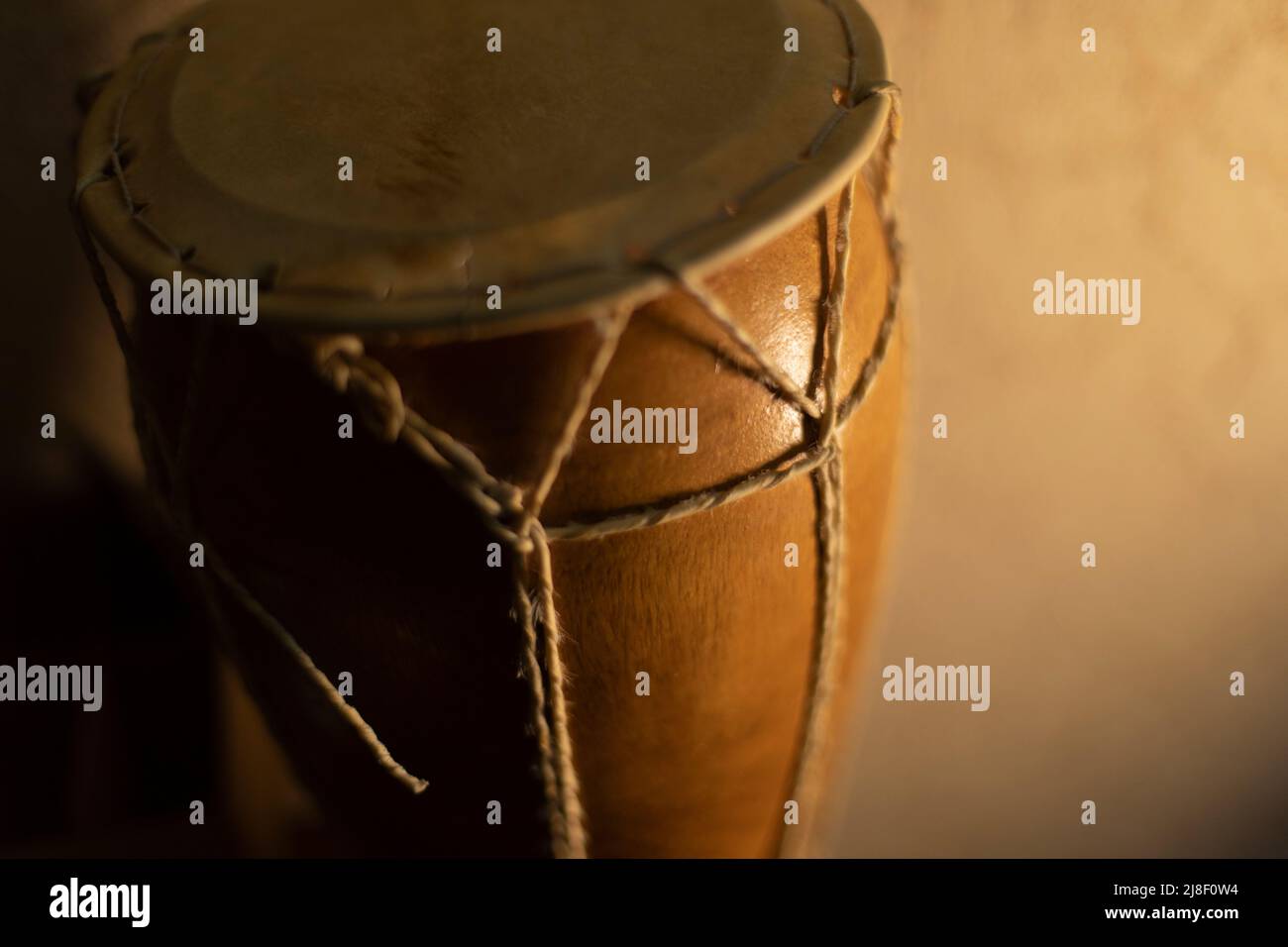 Wooden drum. African percussion instrument. Traditional musical