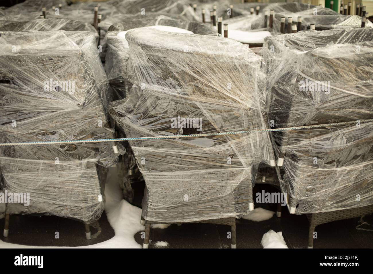 Chairs in film. Preparation for transportation of furniture. Warehouse