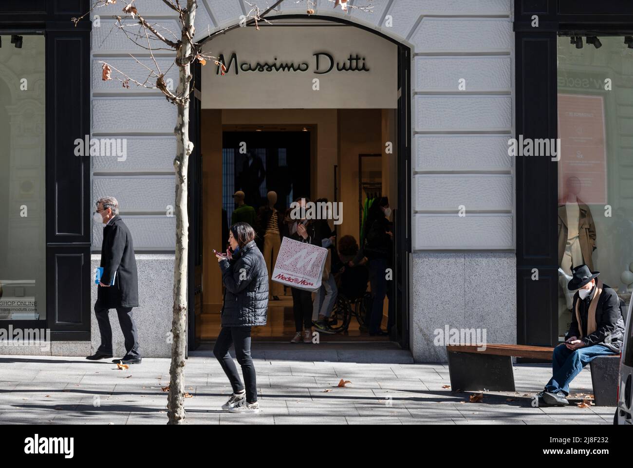 Pedestrians walk past the Spanish clothing manufacturing and brand Massimo  Dutti store in Spain. (Photo by Xavi Lopez/ SOPA Images/Sipa USA Stock  Photo - Alamy