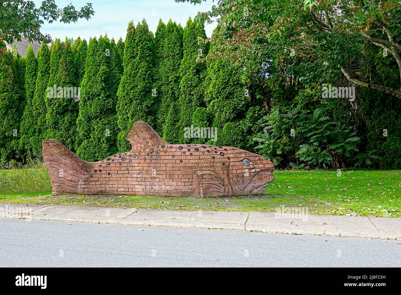 Carved wooden salmon at Fishtrap Creek Park, Abbotsford, B. C., Canada. Stock Photo