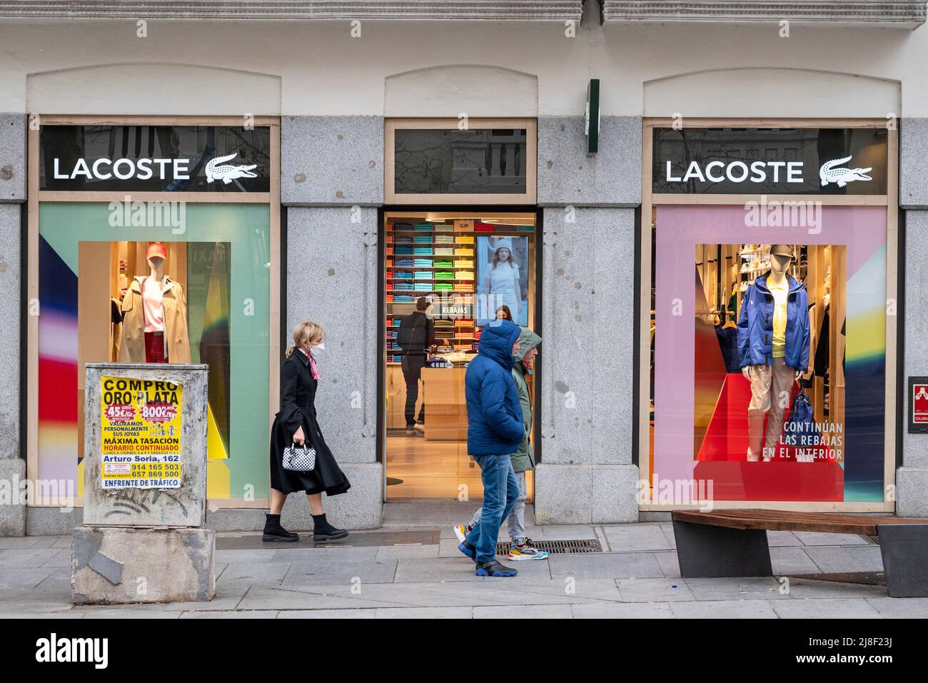 Madrid, Spain. 14th May, 2022. walk past the French brand Lacoste store and logo