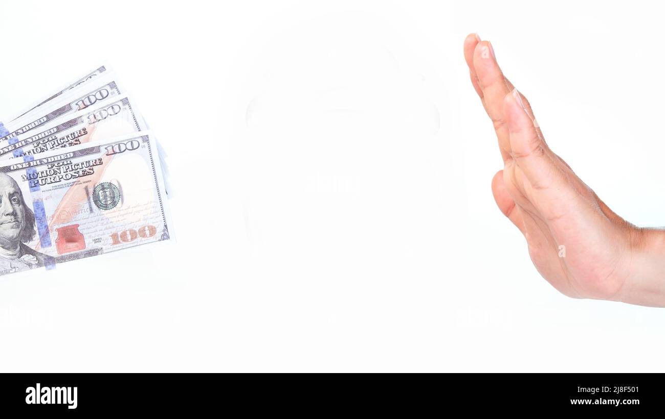 Female hand giving money and hand making refusal gesture on white background. Stock Photo