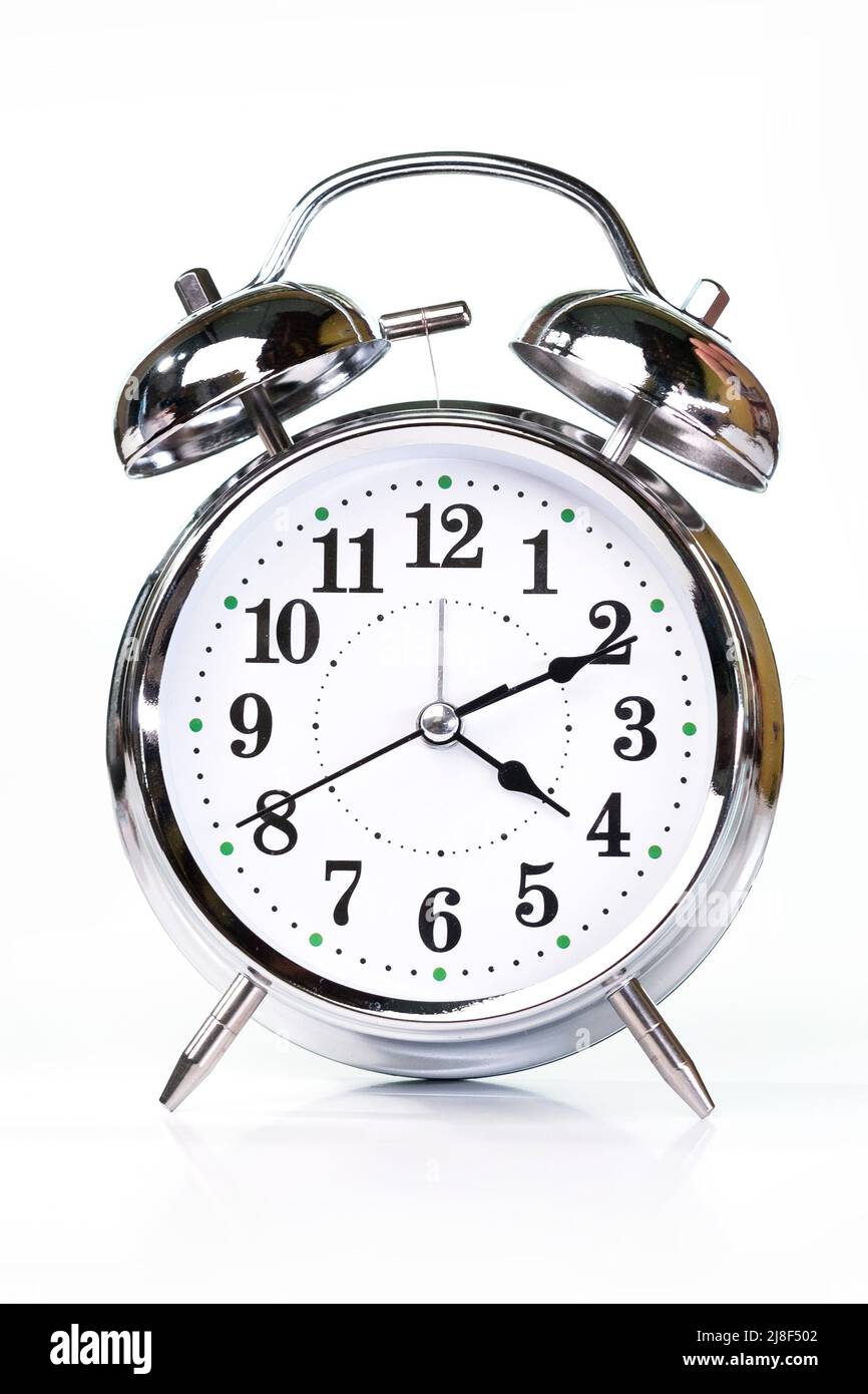 Retro alarm clock isolated on white background Stock Photo - Alamy