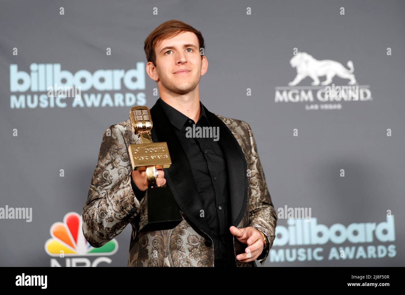 Illenium poses with award for Top Dance/Electric Album in the photo room during the Billboard Music Awards in Las Vegas, Nevada U.S. May 15, 2022. REUTERS/Steve Marcus Stock Photo