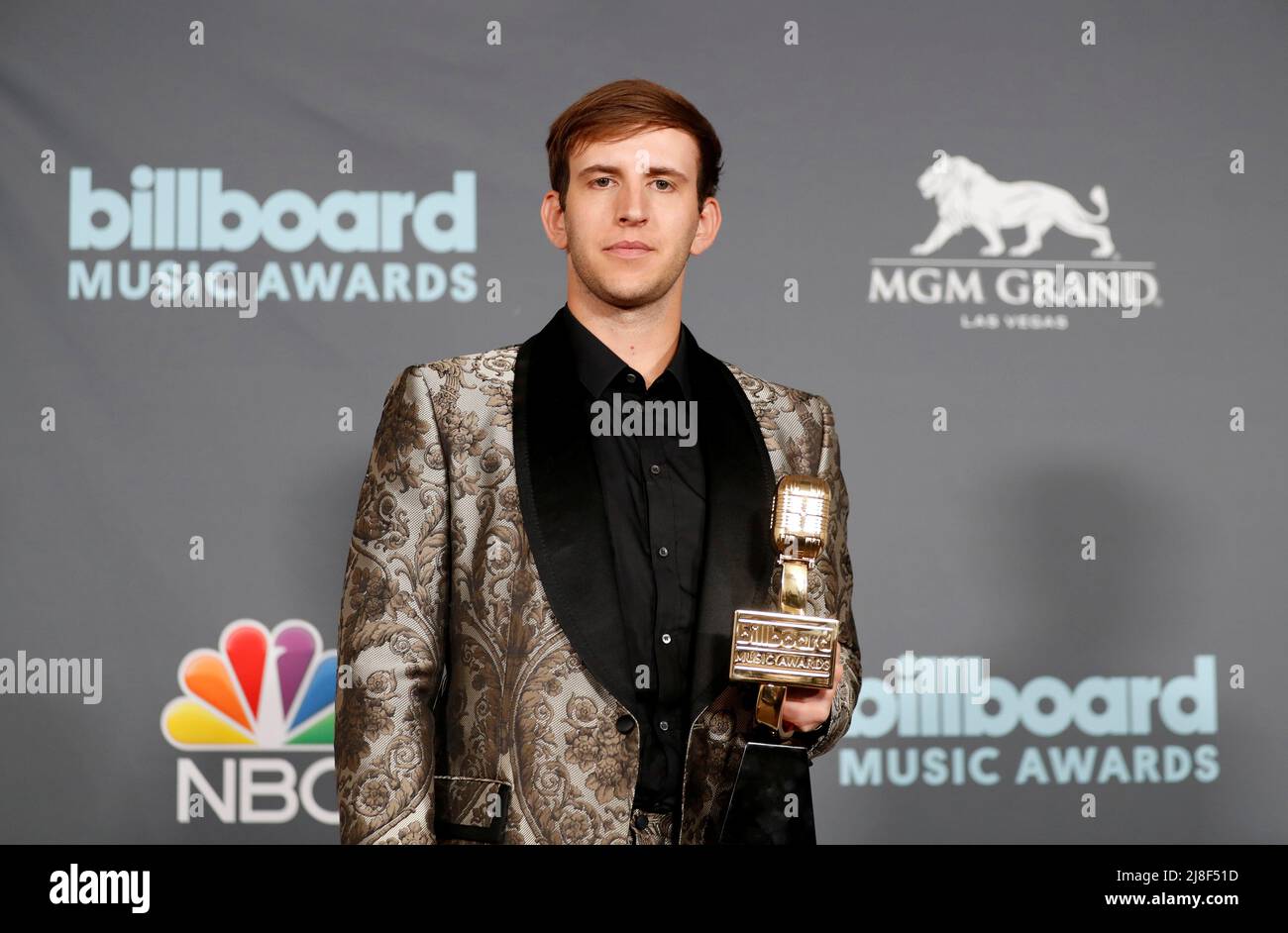 Illenium poses with award for Top Dance/Electric Album in the photo room during the Billboard Music Awards in Las Vegas, Nevada U.S. May 15, 2022. REUTERS/Steve Marcus Stock Photo
