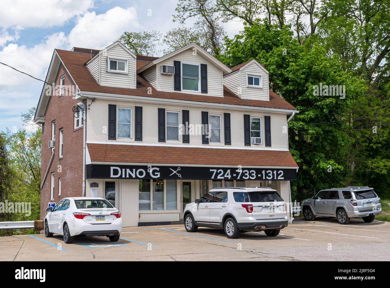 A multi floor building with a beauty salon on the first floor and