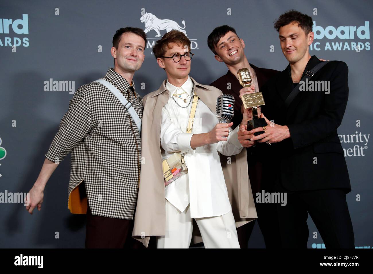 Members of Glass Animals pose with the award for Top Rock Artist in the photo room during the Billboard Music Awards in Las Vegas, Nevada U.S. May 15, 2022. REUTERS/Steve Marcus Stock Photo