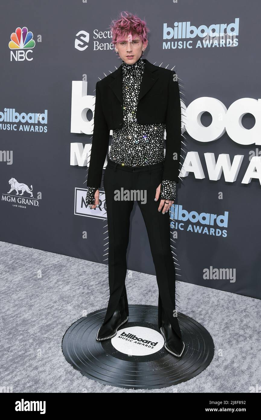 Machine Gun Kelly walking on the red carpet at the 2022 Billboard Music ...