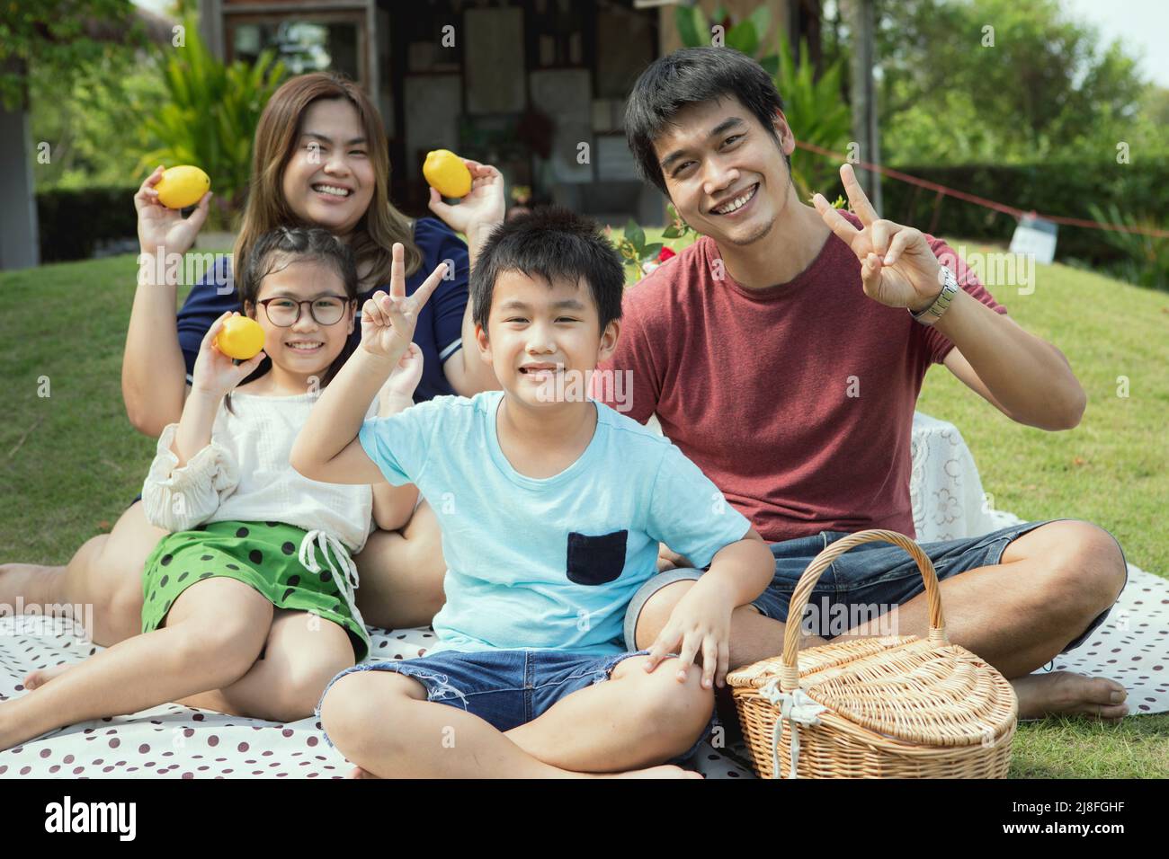 asian family happiness and relax at home garden Stock Photo