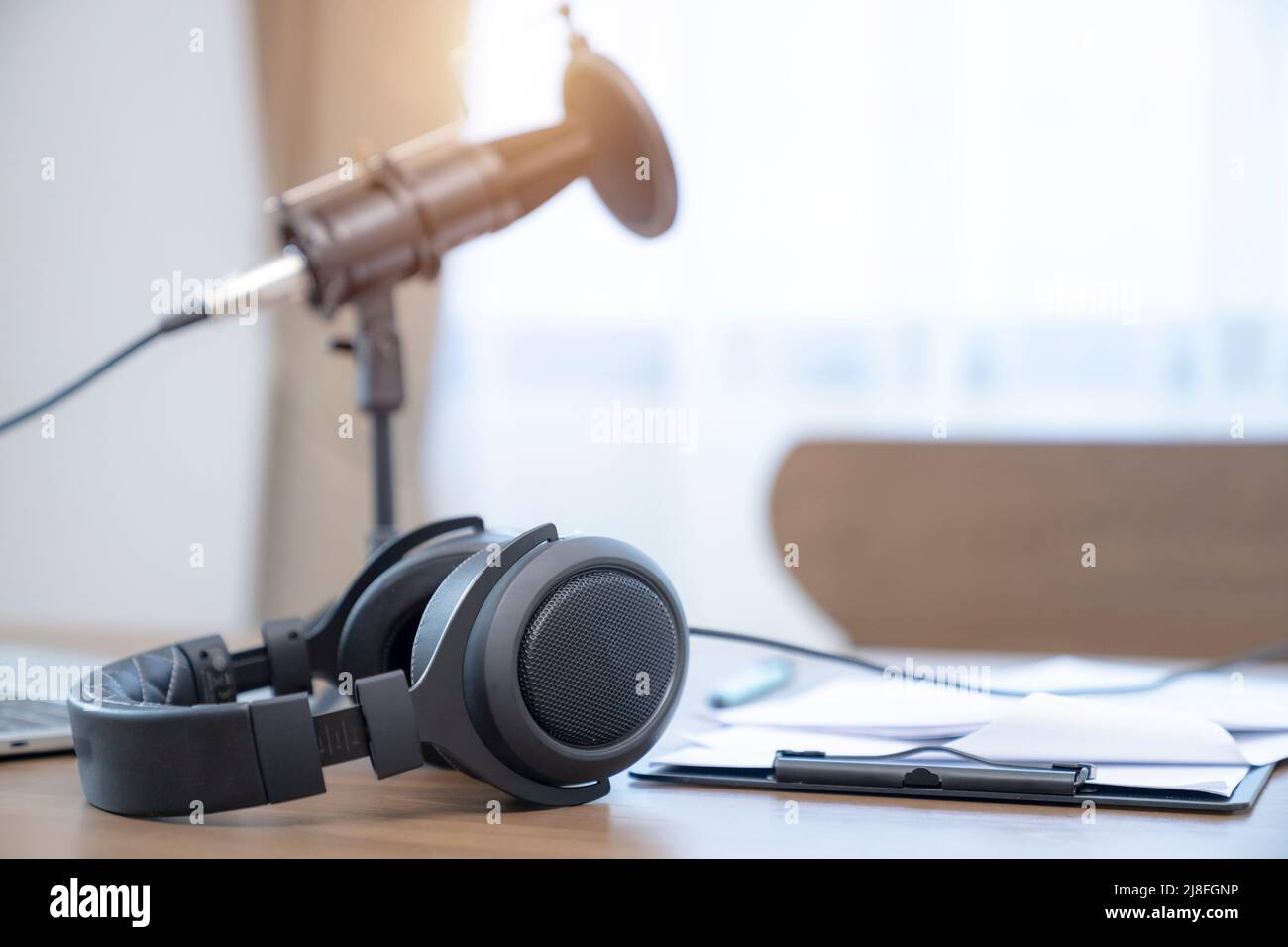 headphone with mic on table, podcast interview online concept Stock