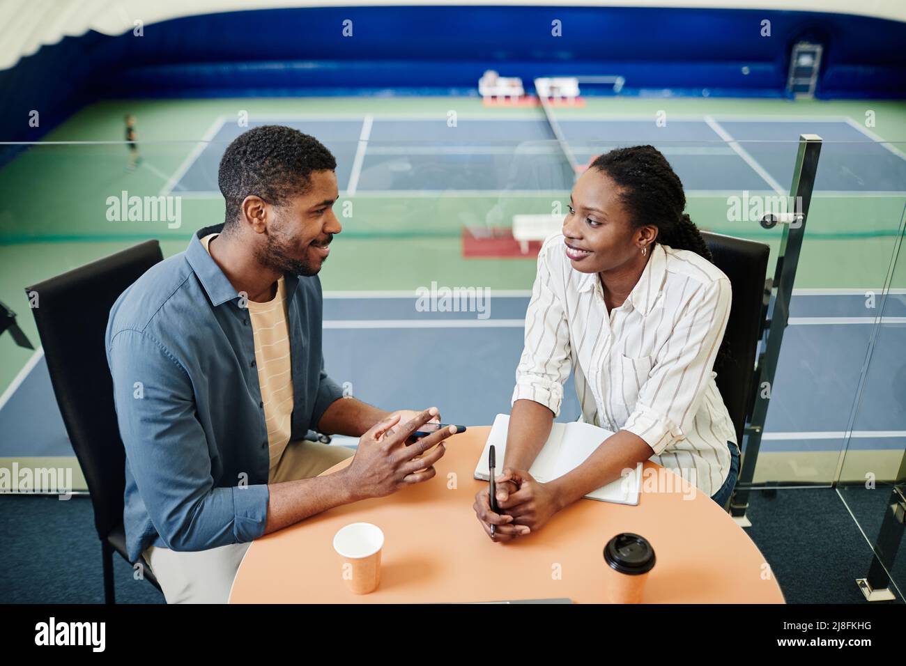Smiling african american sportsman using hi-res stock photography and ...