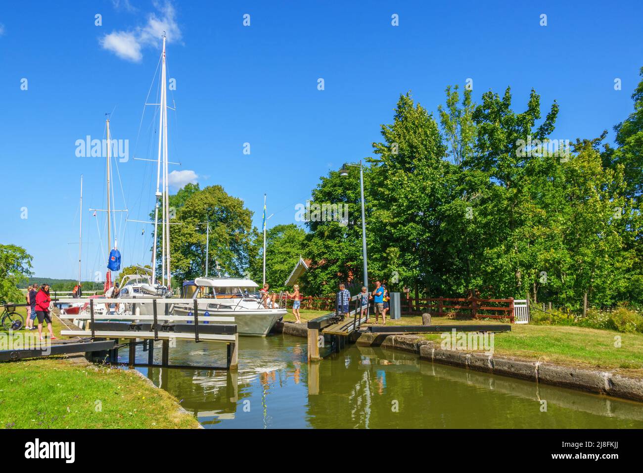 Boats with opening lock gates Stock Photo