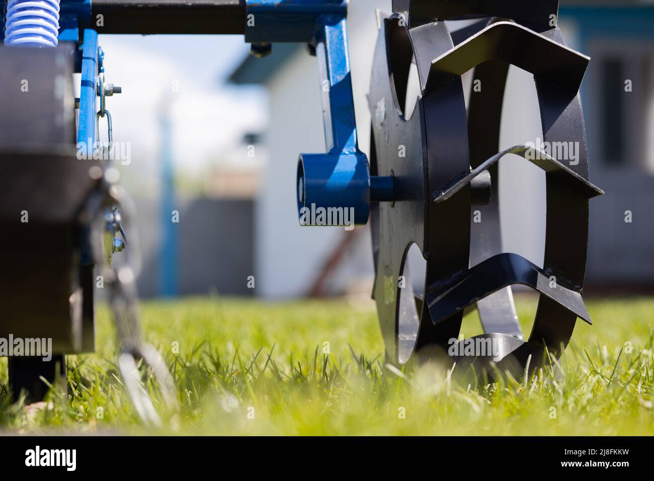 Close up of metal wheel of seeder for agriculture. High quality photo Stock Photo