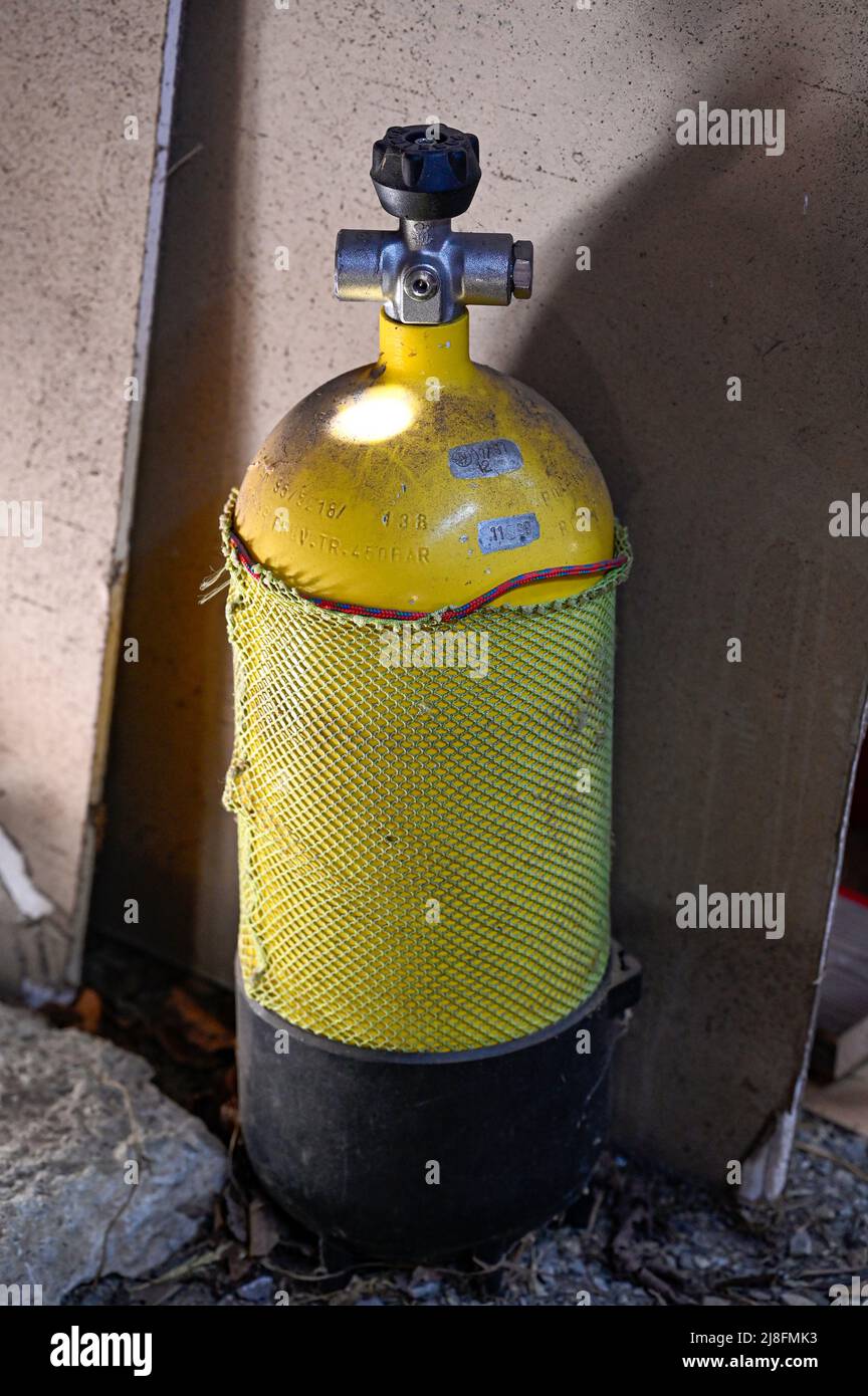 yellow tank for diving standing in garage Stock Photo